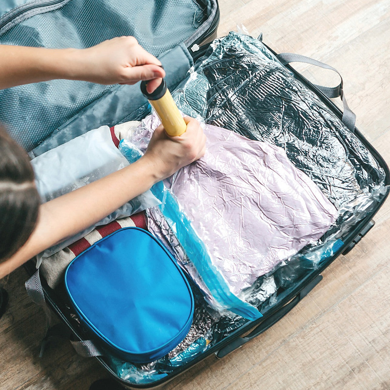 Packing Clothes into Travel Bag - Luggage and People Concept Stock Photo -  Image of belongings, clothing: 94722210